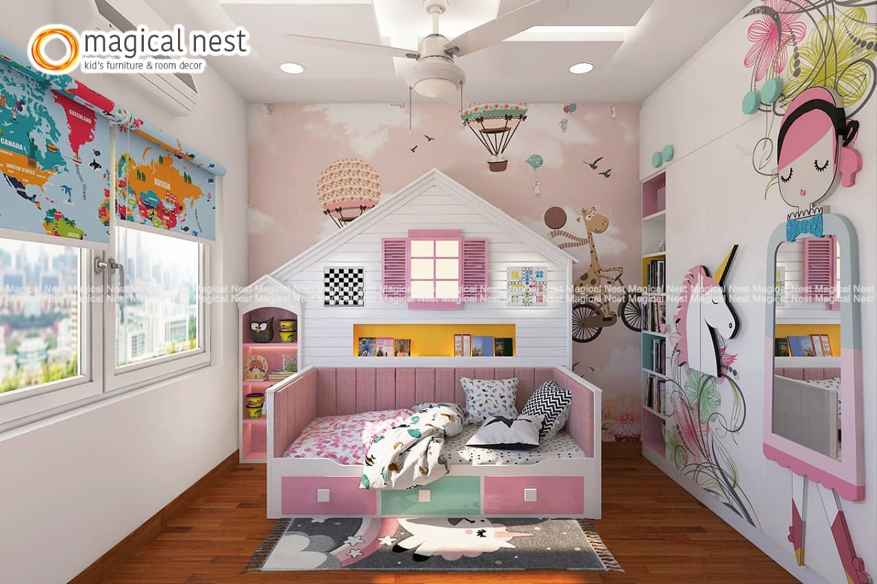 Pink-themed kids’ room in India with a dreamland wallpaper, hut-shaped wall-shelf and the world map blinds.