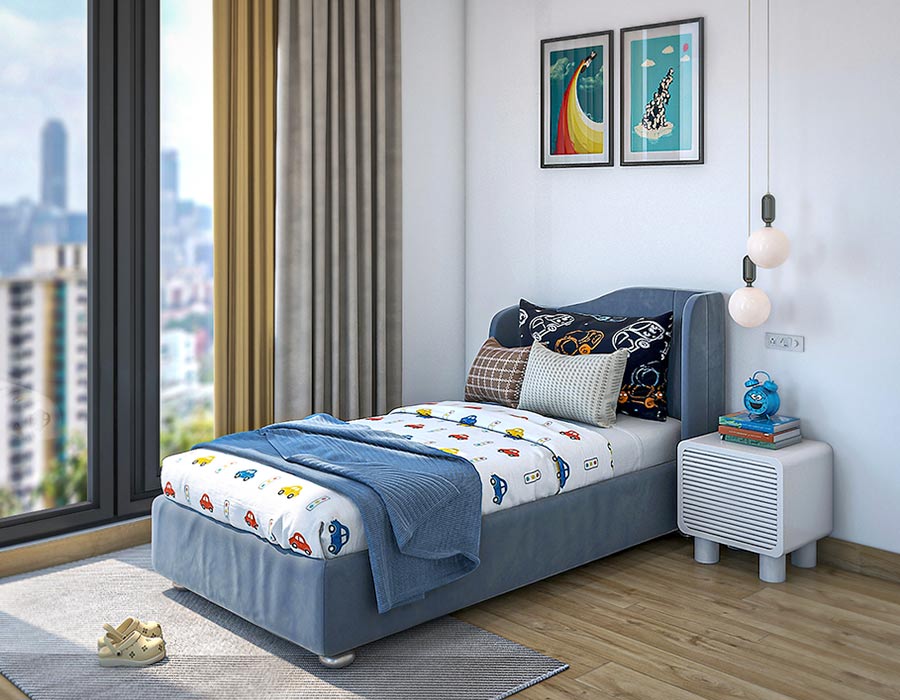 Modern child's bedroom featuring a blue bed, colorful car-themed bedding, and an array of cozy pillows. The room is bright with a large window offering a city view, complemented by light curtains and hardwood flooring. A white bedside table with books and a blue alarm clock sits under contemporary pendant lights, adding charm to this playful and inviting space.