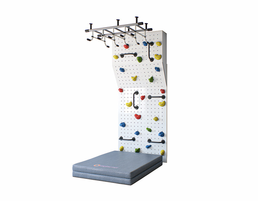 Side view of an Indoor climbing wall for kids with a variety of colorful grips and a grey safety crash pad on the bottom for protection.