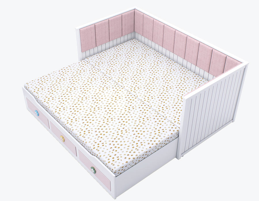 Opened view of a stylish girl's trundle bed in white with pink drawers adorned with floral motifs and a plush pink upholstered headboard.