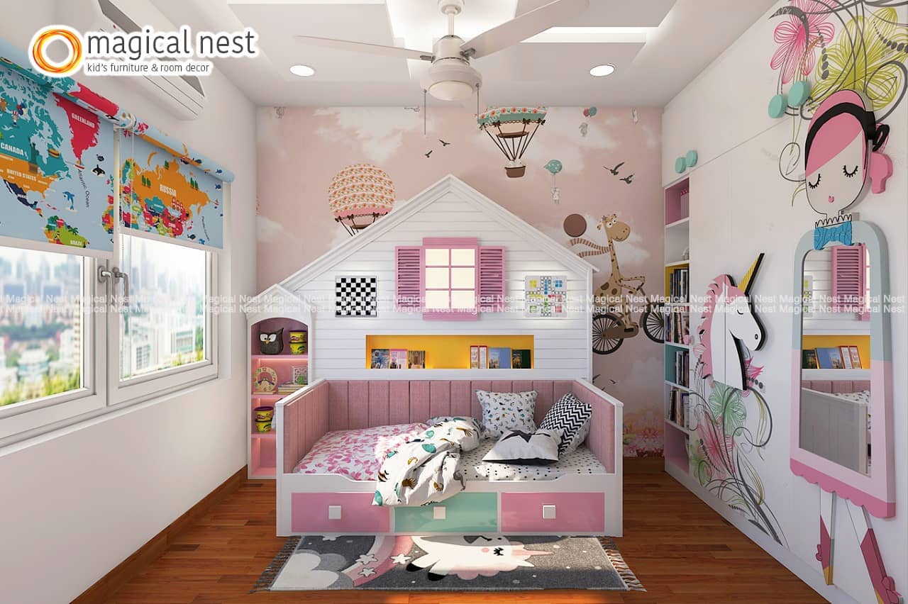 Pink-themed kids’ room in India with a dreamland wallpaper, hut-shaped wall-shelf and the world map blinds. 