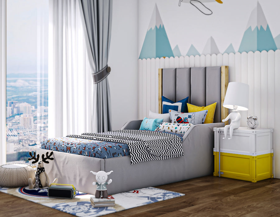 Kids' bedroom with a stylish grey bed featuring a unique tall headboard, complemented by a charming white nightstand and playful decor. Natural light floods the room, creating a bright and inviting space perfect for your child's comfort and creativity.