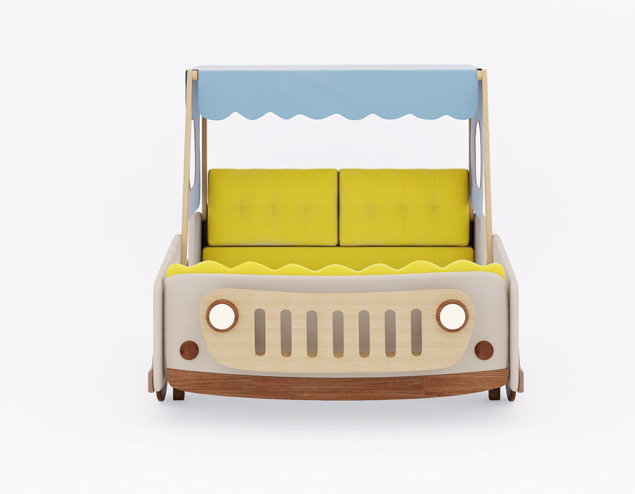 Front view of a kids' bed designed as a vintage jeep with a yellow cushioned backrest and a blue scalloped canopy. The bed features a wooden jeep grille and headlights, complemented by soft beige and natural wood tones, offering a fun and adventurous aesthetic for children.