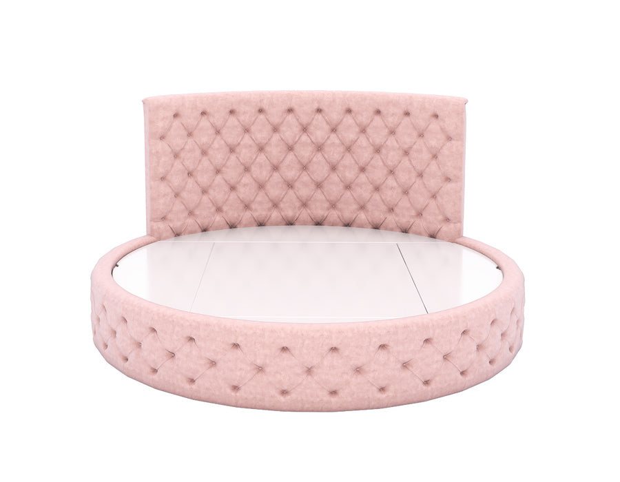 Luxurious round pink tufted bed featuring a high, diamond-patterned upholThe bed frame is covered in soft pink fabric with matching tufted detailing, creating an elegant and comfortable sleeping space for a girl's bedroom.