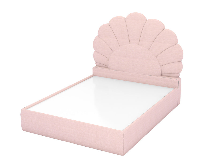 Side view of an elegant pink bed with a distinctive scalloped headboard design, featuring a sleek platform base. The bed frame is upholstered in a soft pink fabric, offering a stylish and comfortable addition to a girl's bedroom.