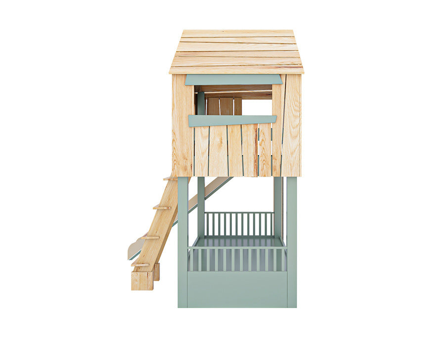 Side view of an isolated image of a wooden cabin-shaped children's bed with a smooth slide and sturdy ladder. The bed features decorative green shutters and a natural wood finish, designed to stimulate creative play and complement a kid's bedroom decor.