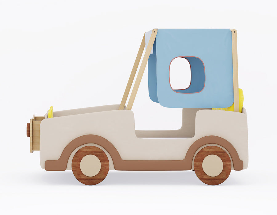 Side view of a kids' jeep-themed bed featuring a beige and natural wood finish, circular wooden wheels, and a light blue fabric canopy with window cutouts. The design includes a yellow cushioned backrest and playful elements resembling a classic jeep for a fun and adventurous look.