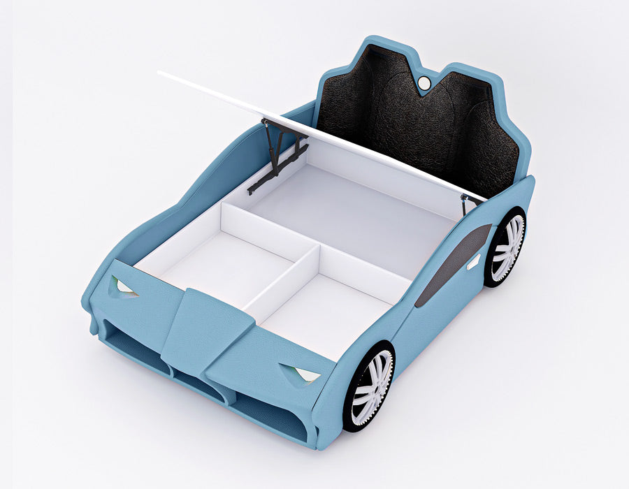 Blue car-shaped children's bed with a raised mattress platform revealing a spacious storage compartment underneath. The bed includes cushioned headboard seats and realistic car detailing, including tires and front headlights, providing both functionality and a playful automotive theme for a child's bedroom.