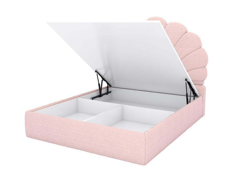 Modern pink storage bed with an elegant scalloped headboard, showcasing the lift-up mechanism revealing spacious compartments for organized storage. The bed features a soft fabric upholstery, combining functionality and style, perfect for a girl's bedroom.