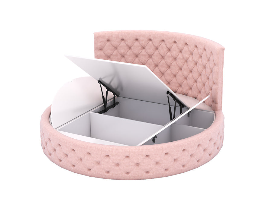 Luxurious round pink tufted bed with a high upholstered headboard, featuring a lift-up mechanism that reveals spacious storage compartments underneath. The bed is covered in soft pink fabric with diamond-patterned tufted detailing, offering both elegance and functionality for a girl's bedroom.