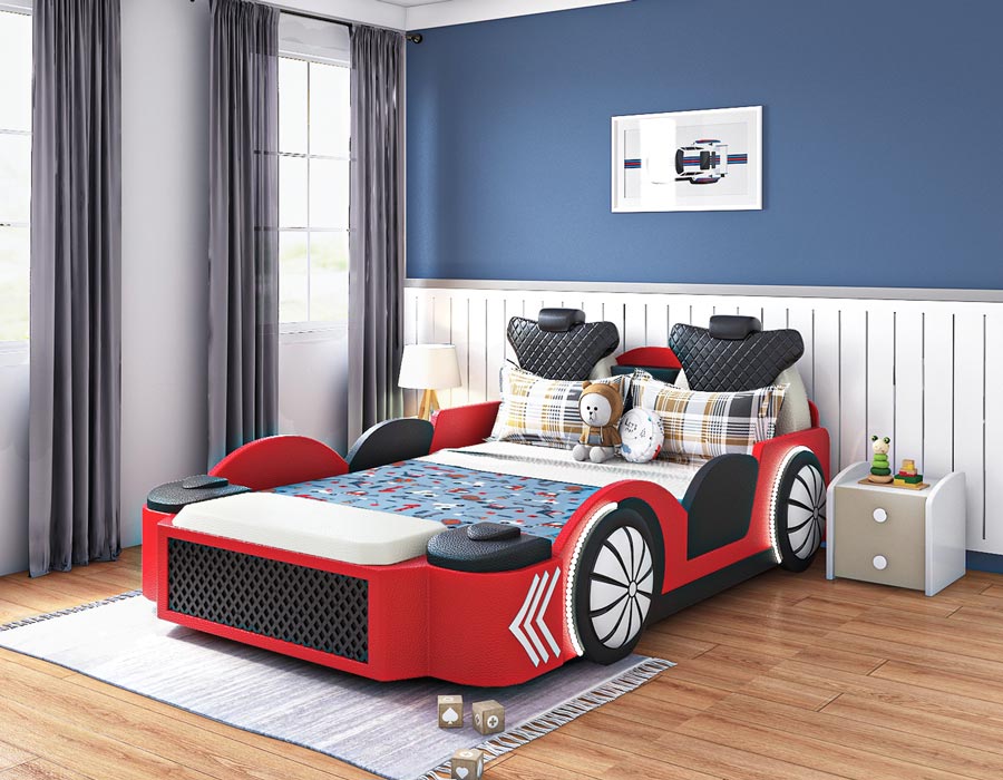 Stylish children's bedroom featuring a red car-themed bed with black and white checkered pillows and cozy bedding. The bed design includes detailed elements like wheels, headlights, and a front grille, making it resemble a race car. The room is decorated with light gray curtains, a framed car print on the wall, and a small bedside table holding a toy frog and books. The polished tile floor adds to the room's modern aesthetic.