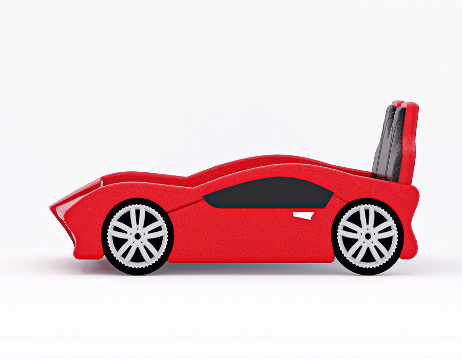 Side view of a red car-themed children's bed, showcasing a sleek and sporty car design with detailed faux wheels and a streamlined body. The bed's headboard mimics car seats, adding to the realistic automotive theme, making it an exciting centerpiece for a child's room.