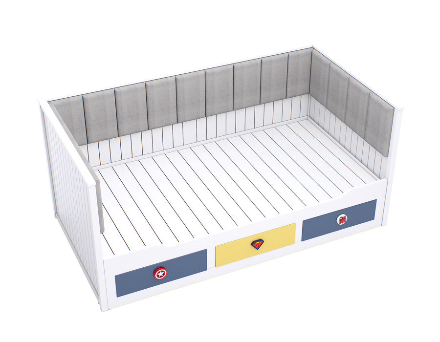 Side view of a white coloured children's trundle bed with superhero emblem drawers, showcasing a clean design with a comfortable, cushioned backrest.