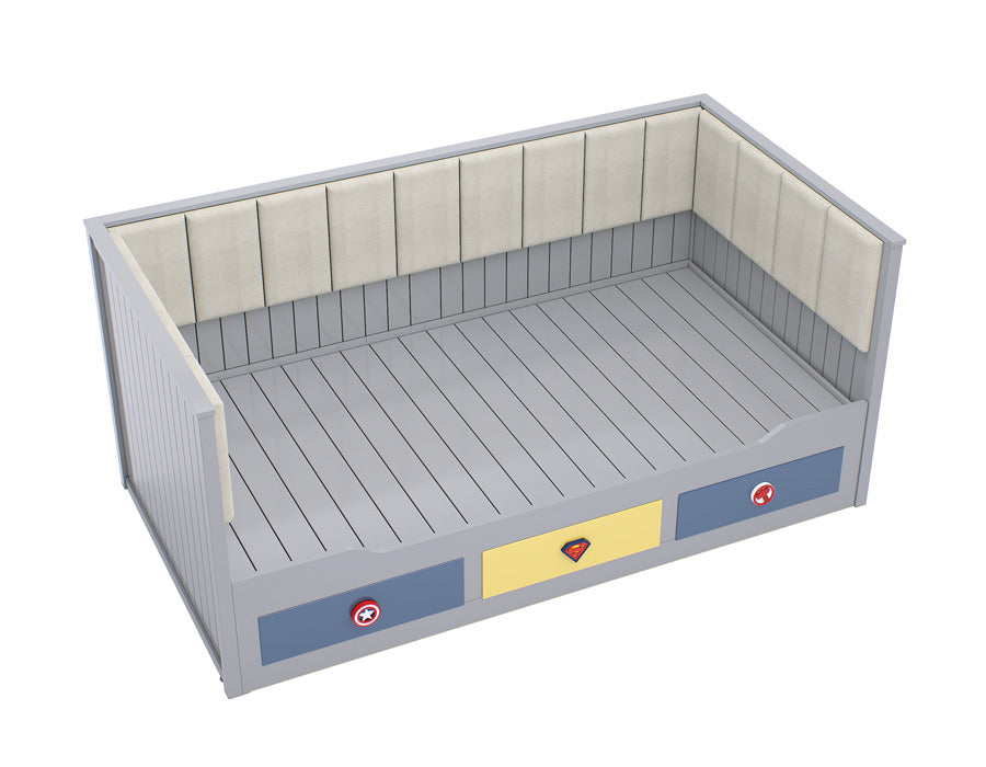 Side view of a grey coloured children's trundle bed with superhero emblem drawers, showcasing a clean design with a comfortable, cushioned backrest.