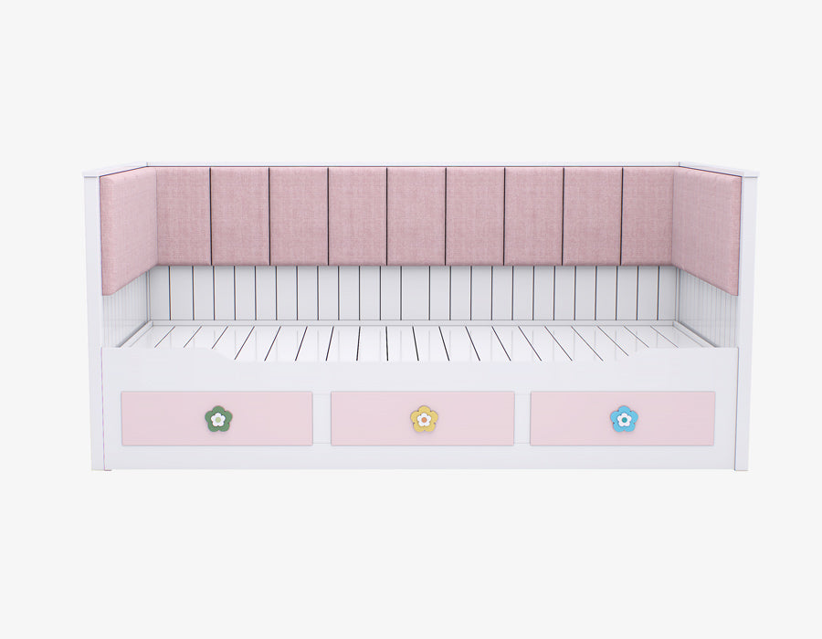 Front view of a stylish girl's trundle bed in white with pink drawers adorned with floral motifs and a plush pink upholstered headboard.