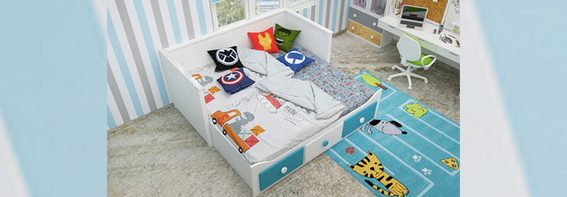 White and blue trundle bed with super hero furnishing
